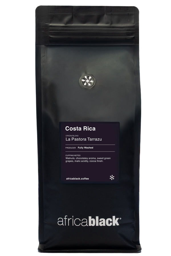Black coffee bag with 'africa black' branding and Costa Rica La Pastora Tarrazu label on a white background